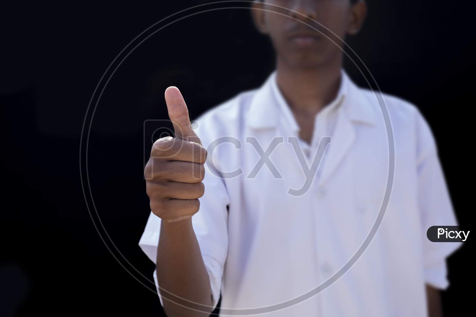 Healthcare, Profession And Medicine Concept - Male Doctor Showing Thumbs Up Over Black Backgrounds