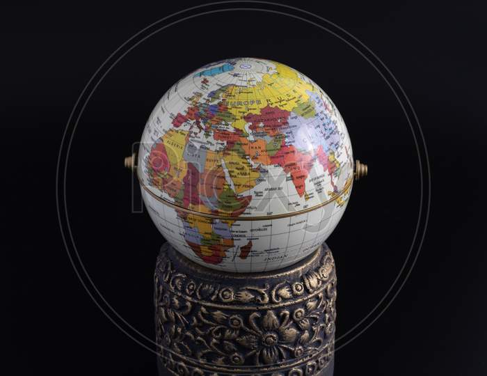 Globe And Vase Isolated On Black Background