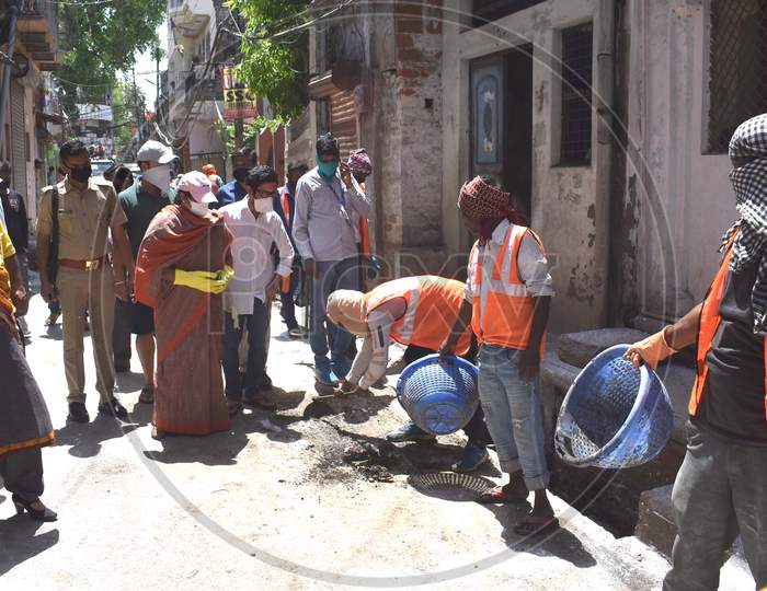 Mayor and municipal employees spray sanitizer On The Streets and Main Roads of Prayagraj During  Nationwide Lockdown In Wake Of Coronavirus Covid-19 Pandemic In Prayagraj,