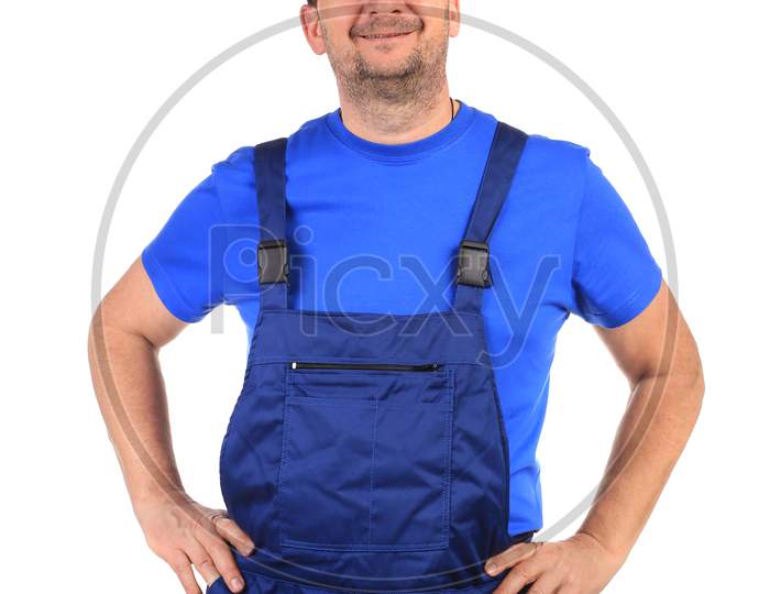 Worker In Blue Overalls. Isolated On A White Background.