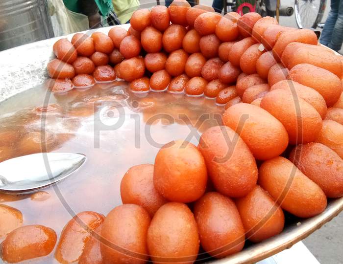 The Indian Sweet Named "Gulab Jamun" Is Selling In Local Market.