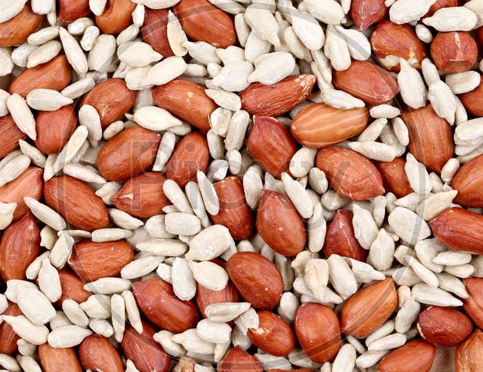 Close Ip Of Peanuts And Sunflower Seeds. Whole Background.