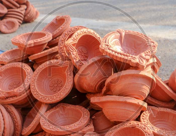 Clay diyas or oil lamps for Diwali for sale at a market in India