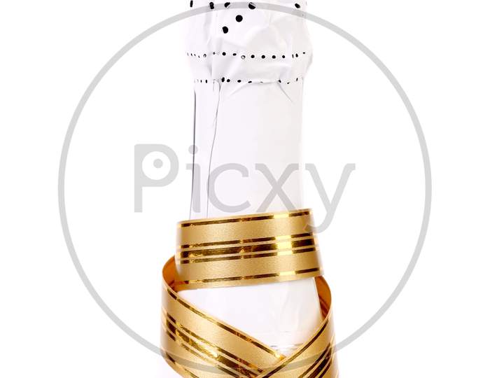 Bottle Champagne With Gold Ribbon. Isolated On A White Background.