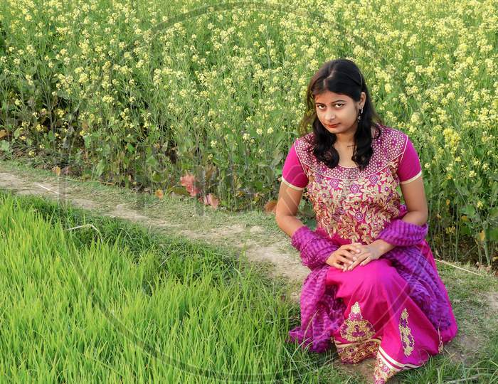 Image Of A Beautiful Village Girl Siting On The Land Of Mustard Seed Ae864378 Picxy