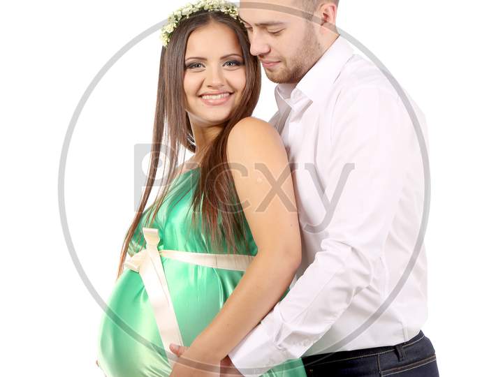 Happy Couple Expecting Baby. Isolated On A White Background.
