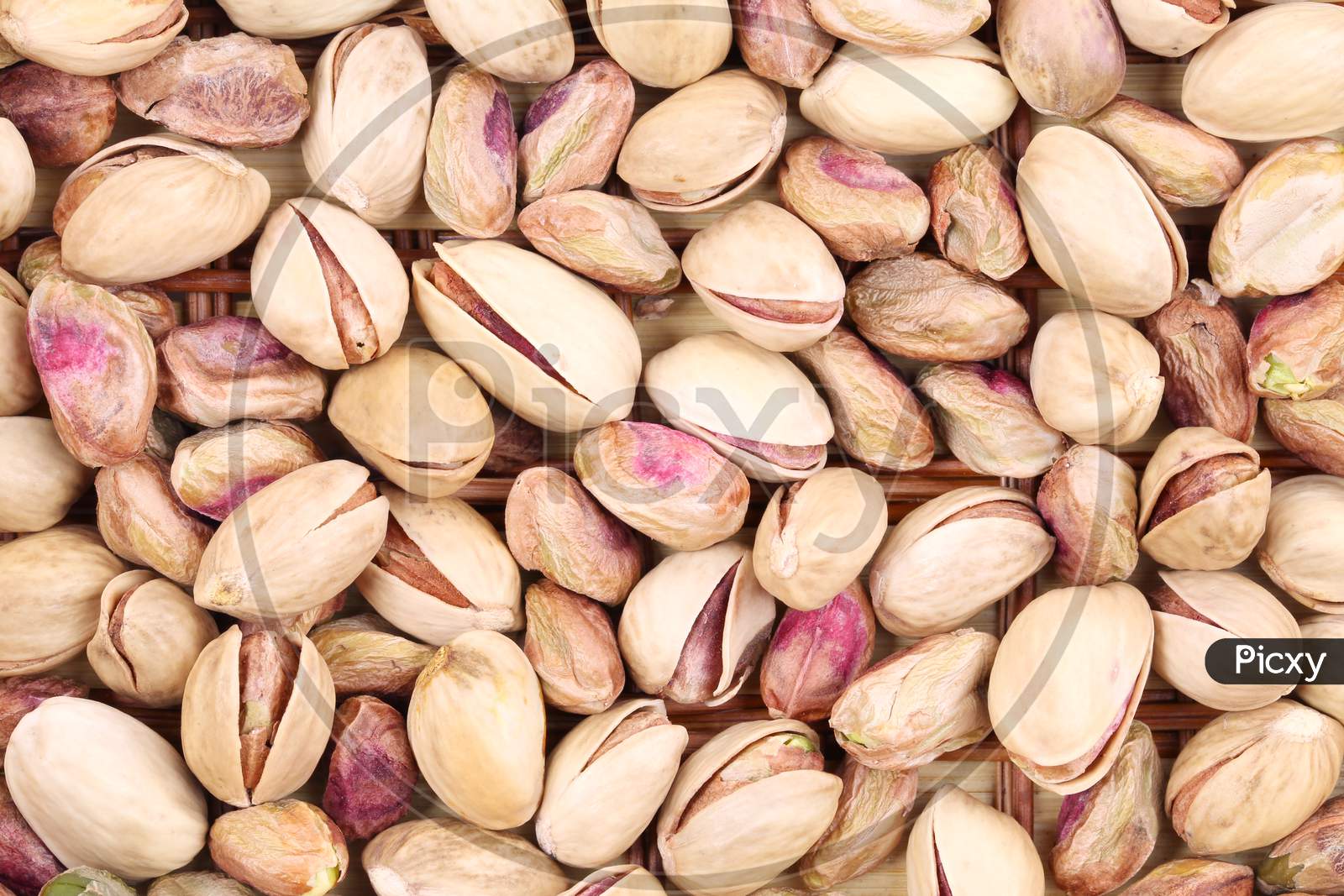 Close Up Of Many Pistachios. Whole Background.