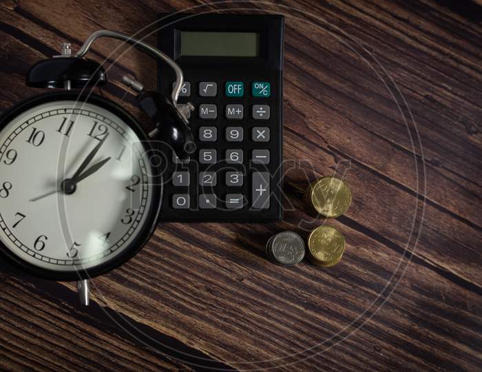 Financial Accounting, Money Calculator And Table Watch On Table