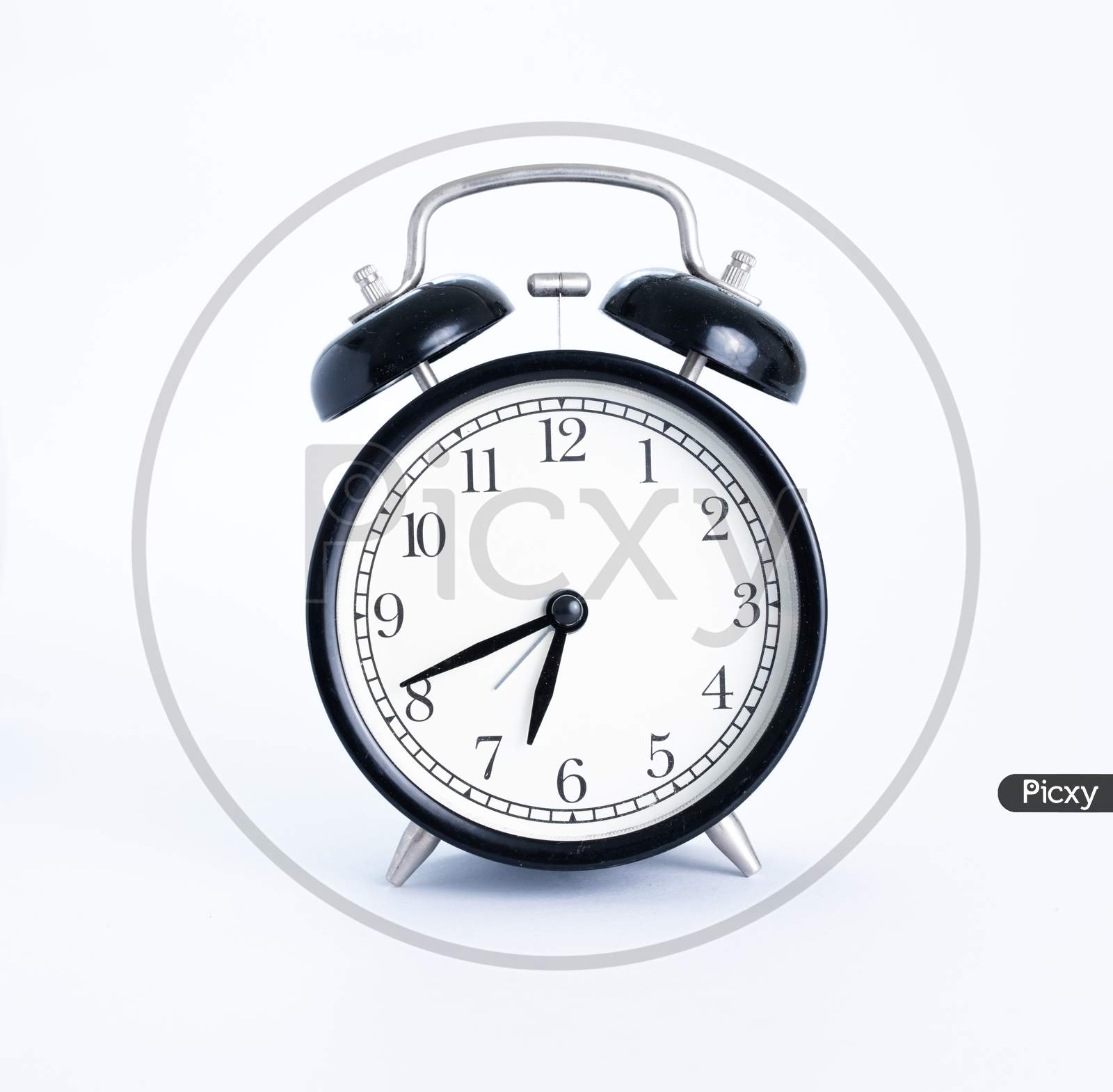 Classic Black Table Clock Isolated On A White Background. Alarm Clock With Copy Space.