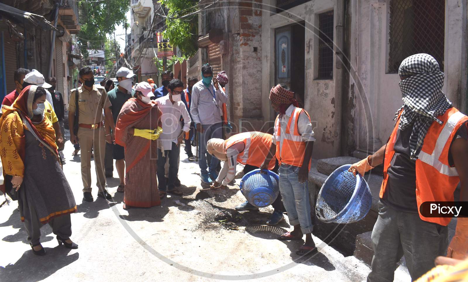 Mayor and municipal employees spray sanitizer On The Streets and Main Roads of Prayagraj During  Nationwide Lockdown In Wake Of Coronavirus Covid-19 Pandemic In Prayagraj,