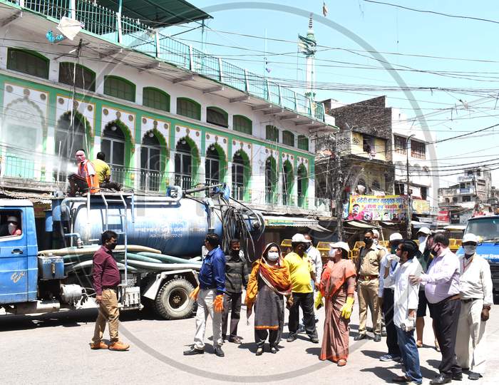 Mayor and municipal employees spray sanitizer On The Streets and Main Roads of Prayagraj During  Nationwide Lockdown In Wake Of Coronavirus or COVID-19 Pandemic In Prayagraj,