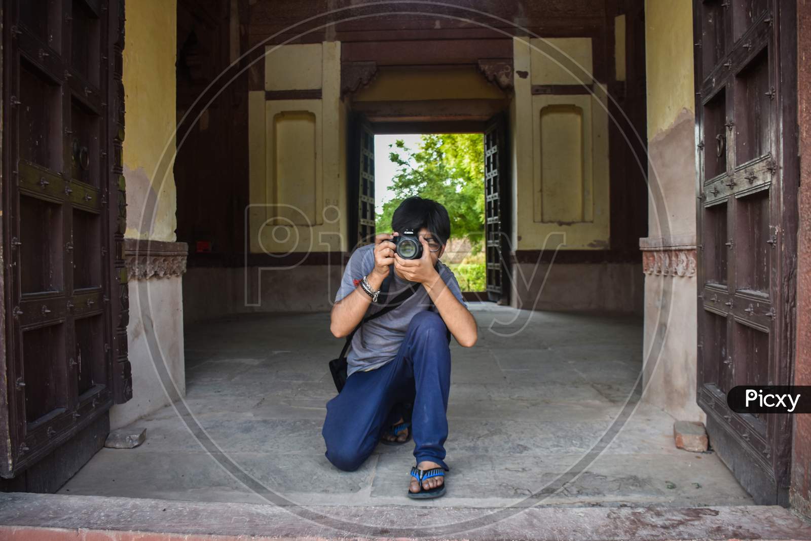 photographer clicking photo of red fort