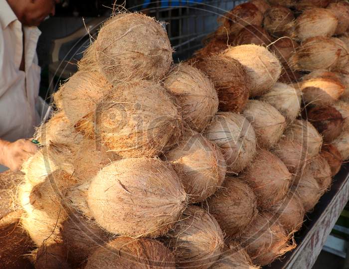 Pile of coconuts in the food market of India