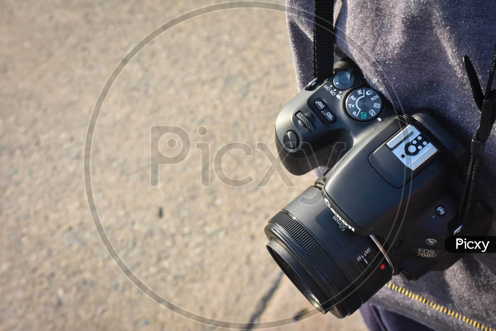 digital black slr camera in hand