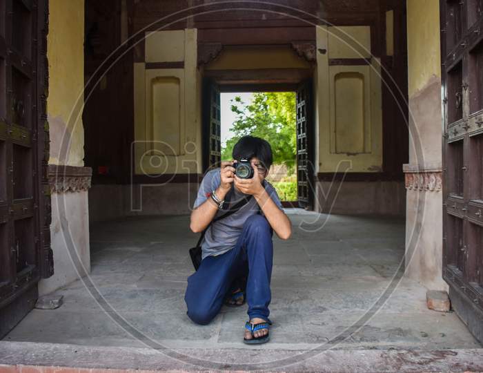 photographer clicking photo of red fort