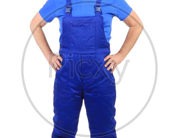 Worker In Blue Overalls. Isolated On A White Background.