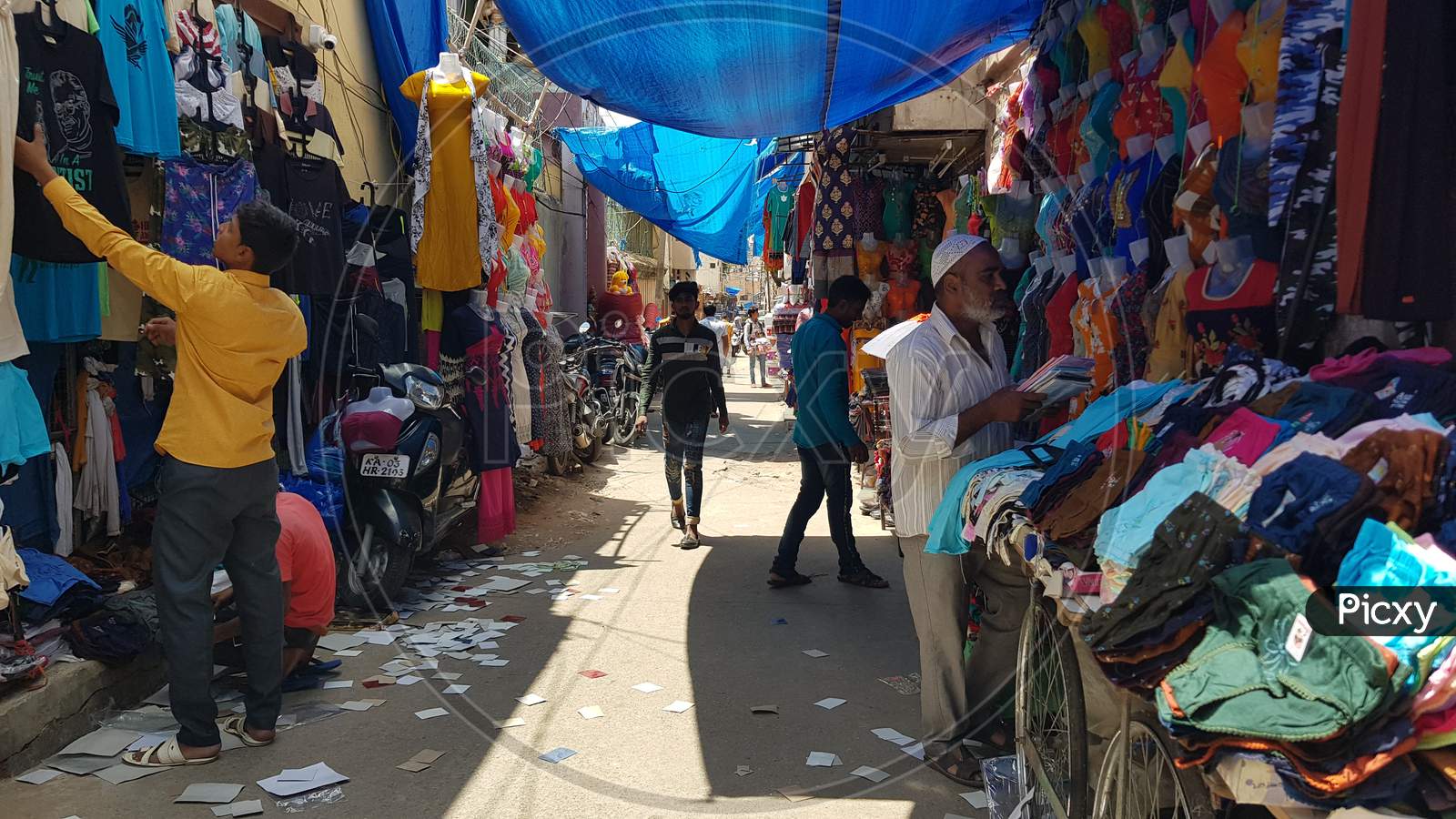 Bengaluru, Karnataka / India - November 19 2019: People walking down the streets on Shivaji nagar in the noon time shopping for dress and fancy items