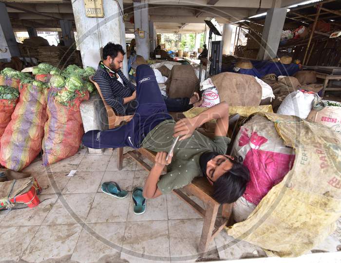 Nagaon,India-April 08,2020 :Vegetable Seller  Wait For Customer  At A Wholesale Vegetable Market During A Nationwide Lockdown Imposed In The Wake Of Coronavirus Pandemic, In Nagaon District Of Assam ,India
