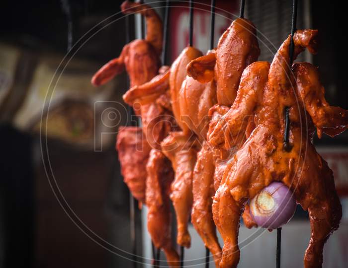 chicken meat hanging in the Indian street market