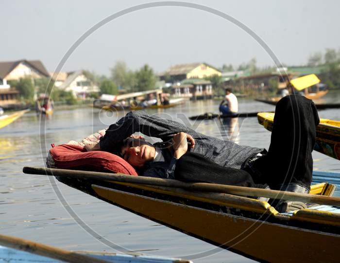 Dal Lake, A Boat man Sleeping In a Boat at Dal Lake Srinagar Because Of  Tourism Got Effected Due to Corona Virus Or COVID-19 Outbreak in India