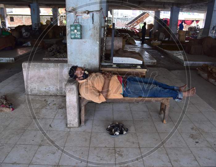 Nagaon ,India-April 08,2020: A Vendor Sleeps  At A Wholesale Fruits And Vegetable Market During A Nationwide Lockdown Imposed In The Wake Of Coronavirus Pandemic, In Nagaon District Of Assam ,India