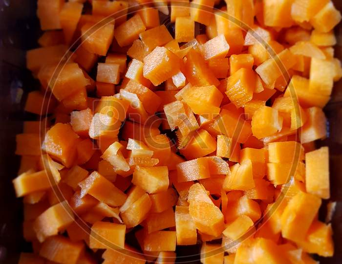 Closeup of diced carrots ready to be cooked