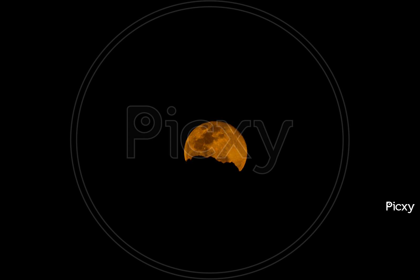 Pink Moon 2020, Super Full Moon hiding behind clouds, April 8, 2020 as seen from Hyderabad