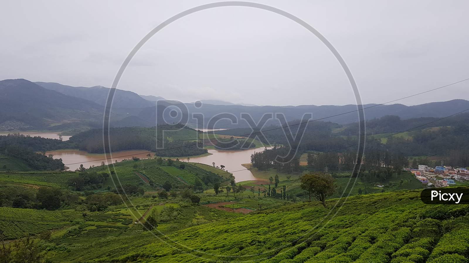 Beautiful wide angle view of the flooded and overflowing 'Pykara Lake' after heavy rainfall in Ooty, a beautiful hill station in South India.