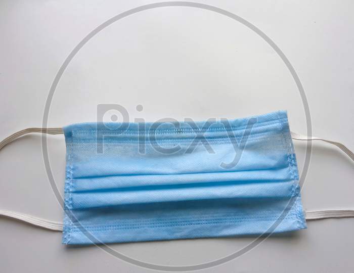 Surgical or disposable 3 ply mask isolated on white background, medical equipment