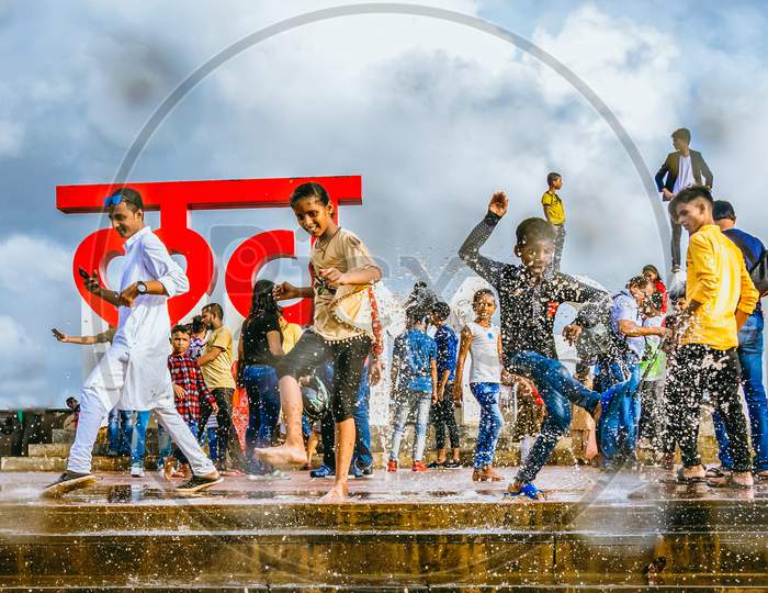 Love Point Mumbai Bandra Children Splashing Water During Monsoon