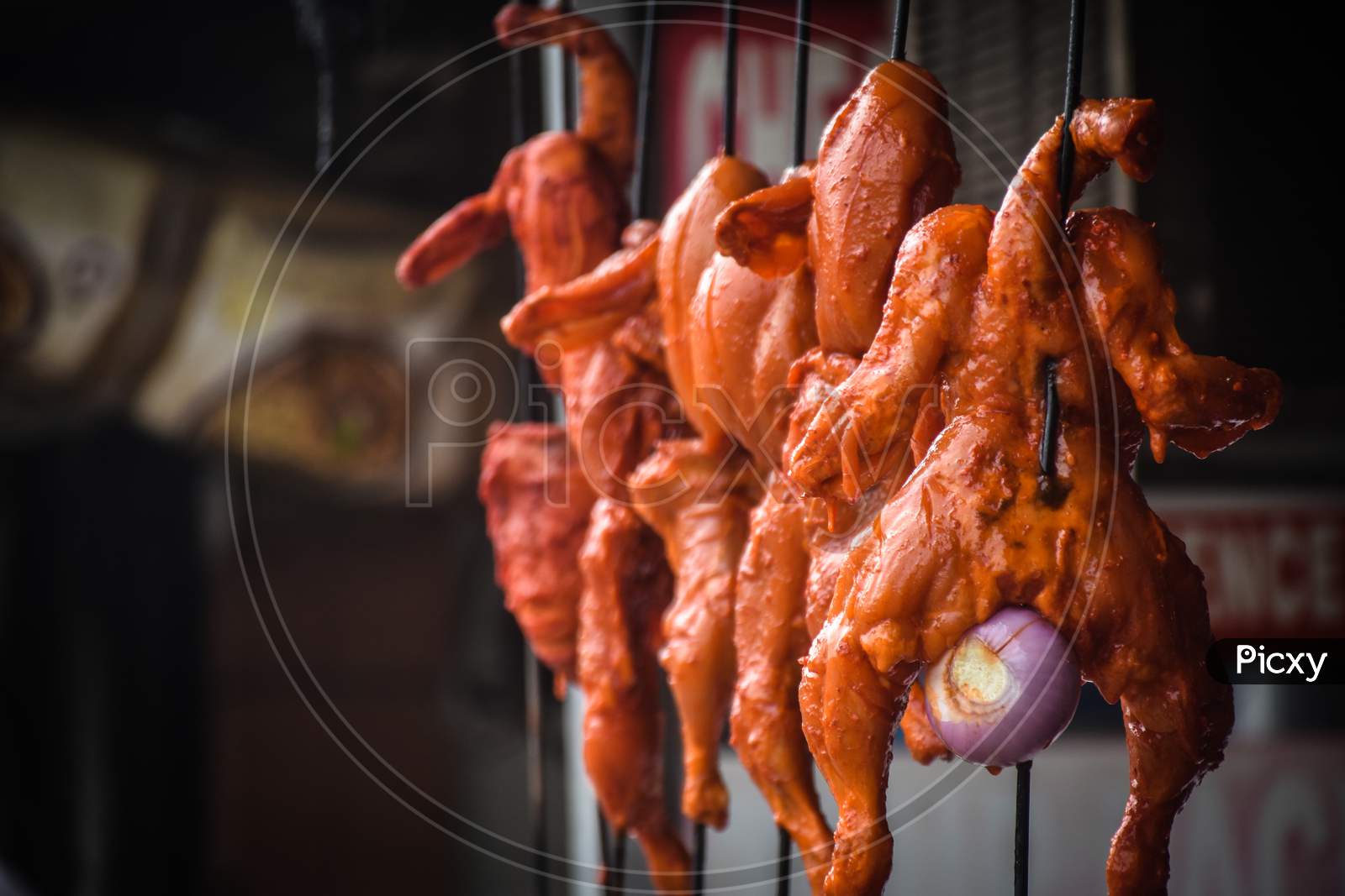 chicken meat hanging in the Indian street market