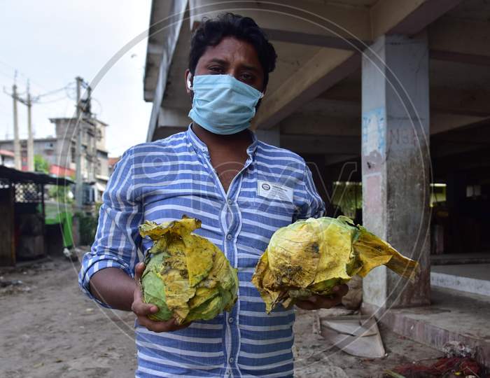 Nagaon,India-April 08,2020:A Vendor Show His  Damaged Vegetables At A Wholesale Vegetable Market During A Nationwide Lockdown Imposed In The Wake Of Coronavirus Pandemic, In Nagaon District Of Assam ,India