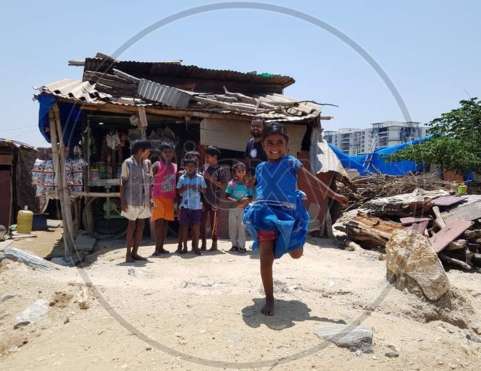 Bengaluru, Karnataka / India - August 02 2019: Kids standing/playing in front of a shack shop that sells condiments