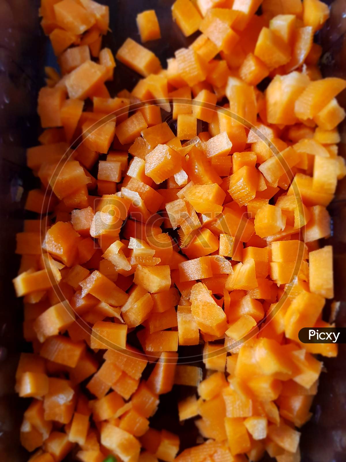 Closeup of diced carrots ready to be cooked