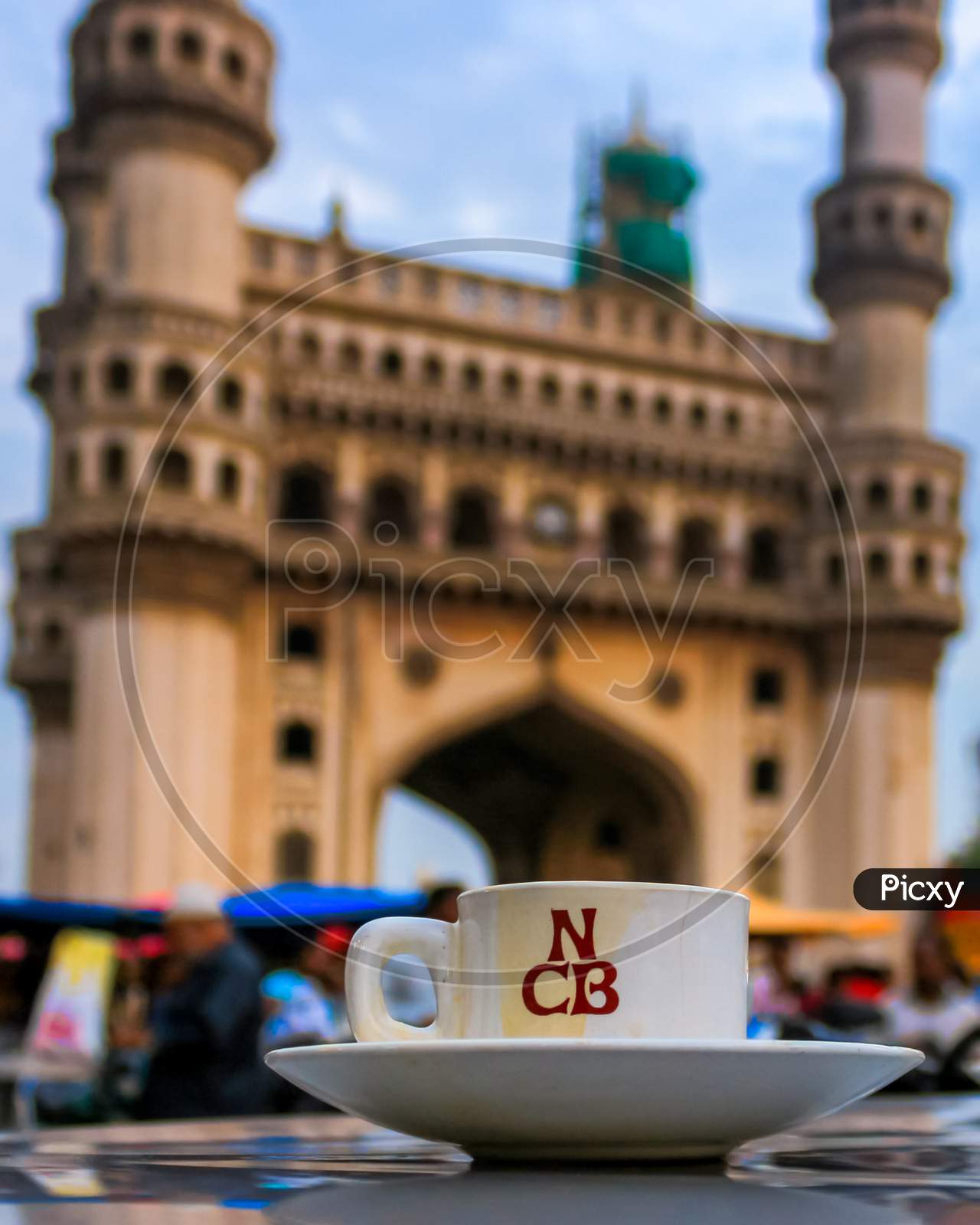 Nimra Cafe Irani Tea or Chai Cup With Charminar In Background