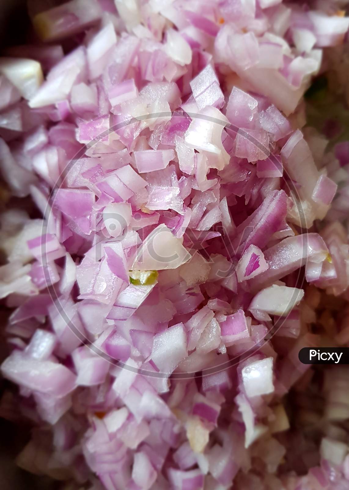 Closeup of freshly chopped and grated onions