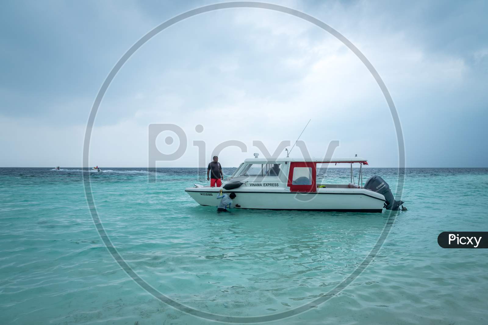 A small fishing boat anchored at Maafushi island, Maldives