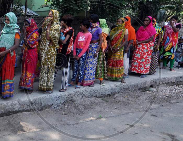 Guwahati : Needy People Stand In Queues To Collect Ration From A Distribution Centre During The Nationwide Lockdown In The Wake Of The Coronavirus Pandemic, In Guwahati  Wednesday, April 8, 2020.