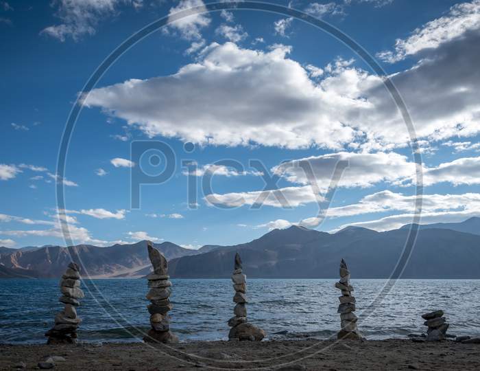 Stones arranged artistically on the shores of Pangong Lake, Ladakh