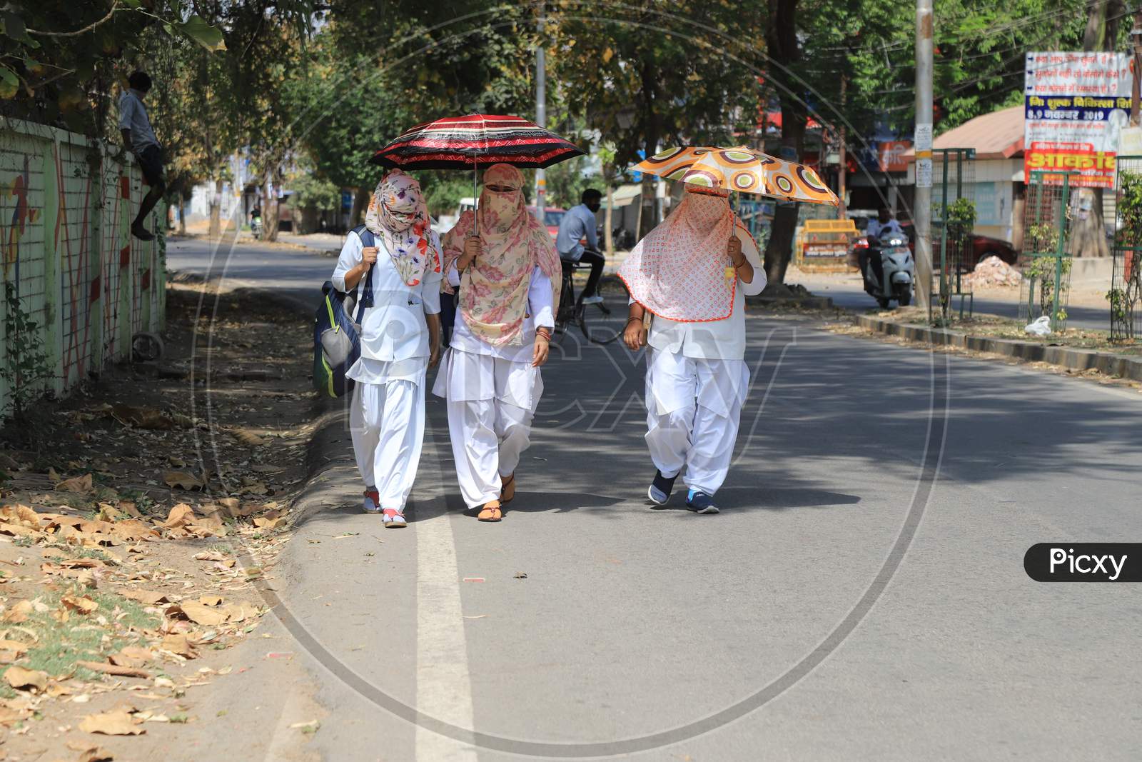 Nurses Using Umbrella Walk In The Empty Road During A 21-Day Nationwide Lockdown To Slow The Spreading Of Coronavirus Disease (Covid-19) In Prayagraj, April 9, 2020
