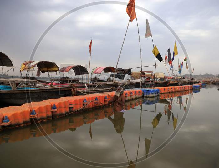 A Sadhu Or Holy Man Offering Prayers After Takesh Holy Dip In The Clean Water Of River Yamuna During A 21-Day Nationwide Lockdown To Slow The Spreading Of Coronavirus Disease (Covid-19) In Prayagraj, April 9, 2020.