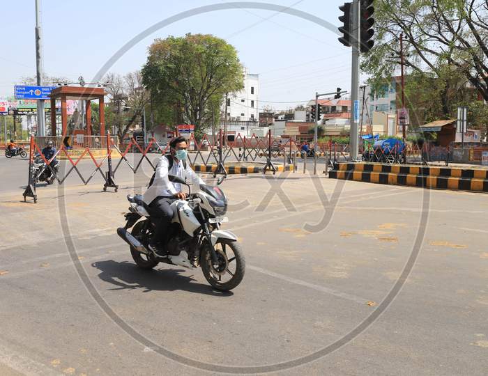 A Dcotor Ride Bike On The Empty Road During A 21-Day Nationwide Lockdown To Slow The Spreading Of Coronavirus Disease (Covid-19) In Prayagraj, April 9, 2020.