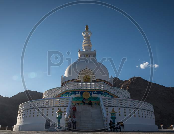 Leh, Kashmir, India - September 20 2019: View of the famous Buddhist monument 'Shanthi Stupa' with the mountains and clear sky in the background