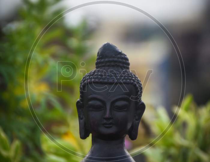 statue of buddha with a blur background