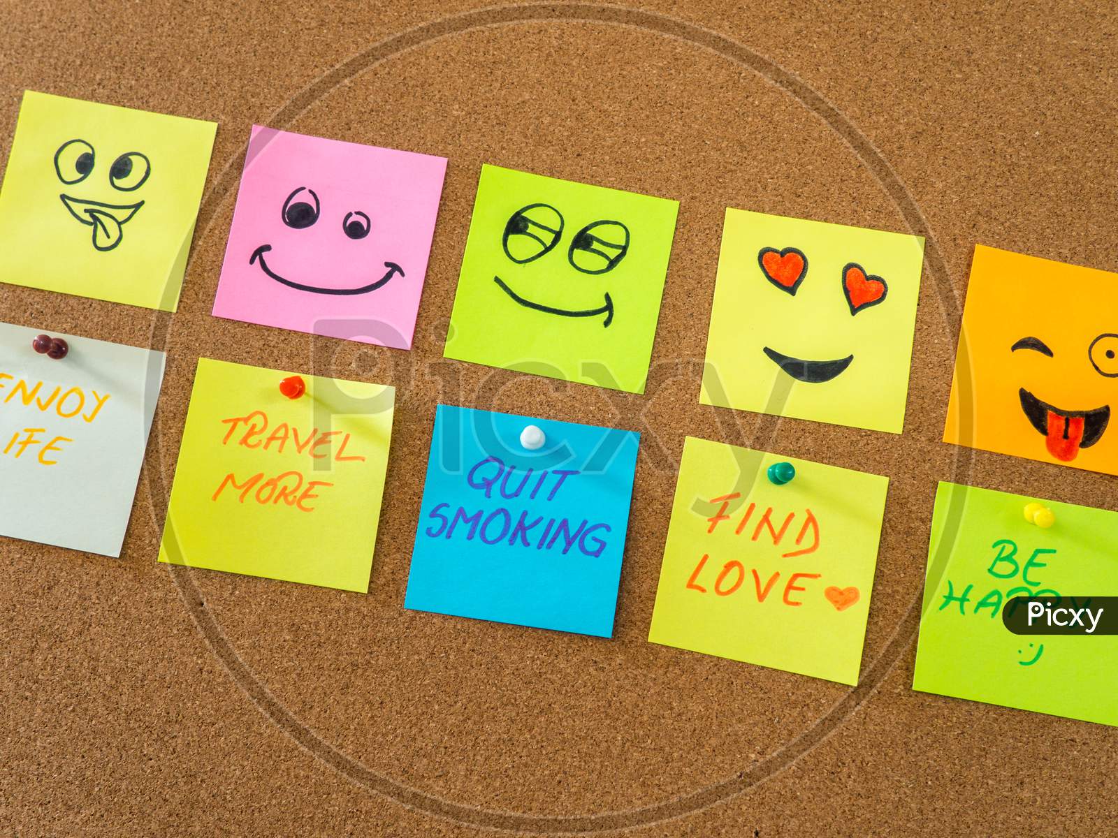 note papers with smiley faces on cork board office concept photo