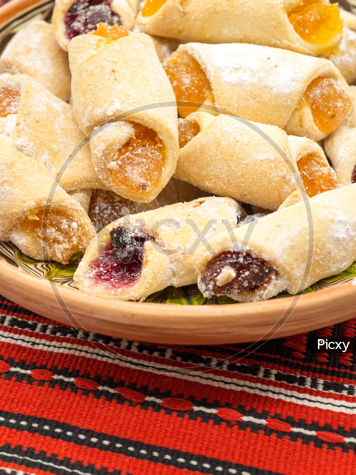 traditional romanian festive dessert dumplings filled with assorted turkish delight served on a traditional cloth