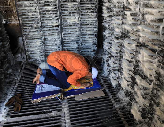 Muslim worker in vermicelli factory offers Friday prayers during the holy month of Ramadan during a government-imposed nationwide lockdown as a preventive measure against the COVID-19 or Coronavirus, at a factory, in Prayagraj on May 1, 2020.