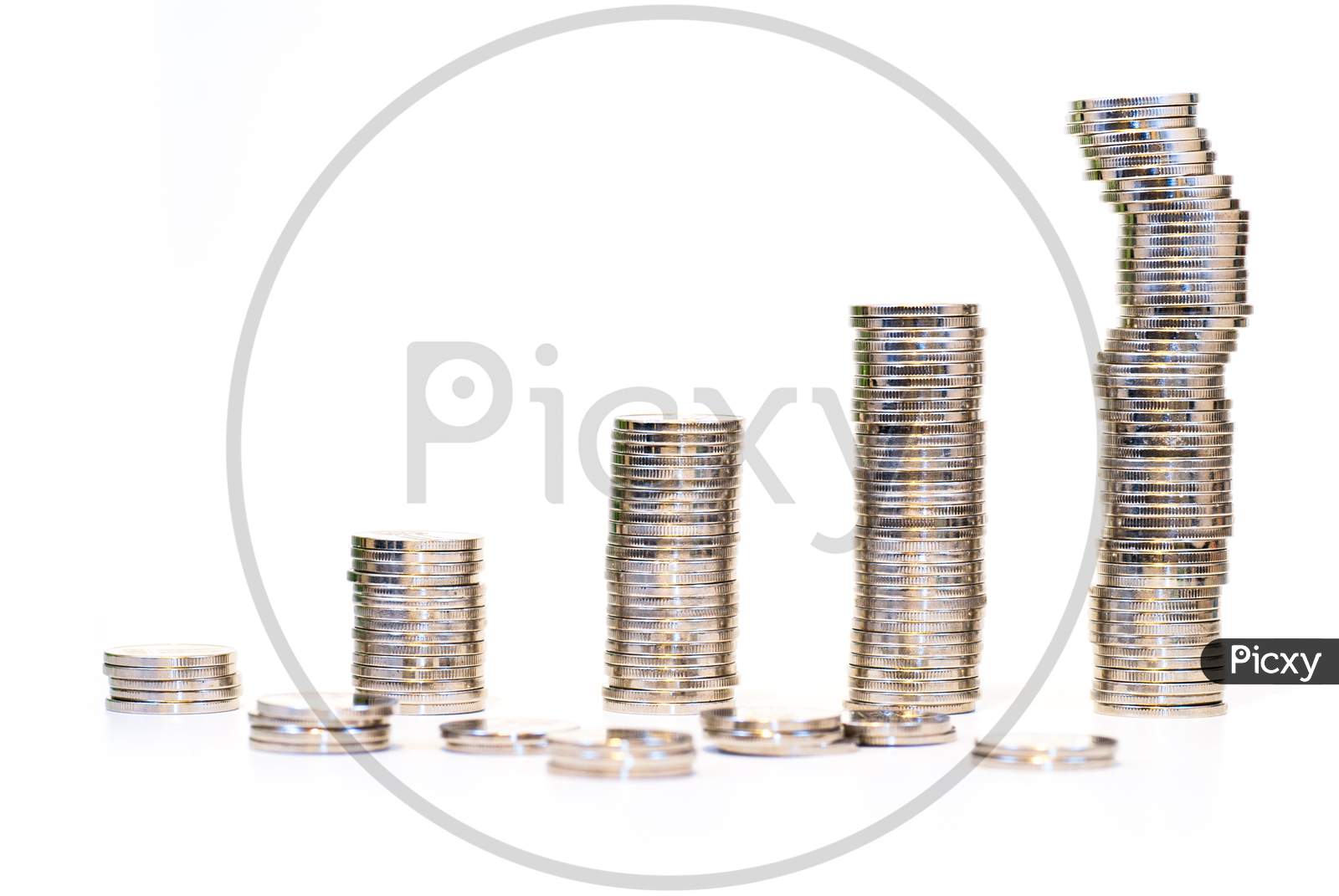 coins stacks over white background economic growth drop concept abstract photo