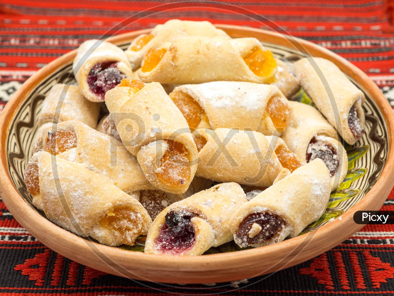 traditional romanian festive dessert dumplings filled with assorted turkish delight served on a traditional cloth