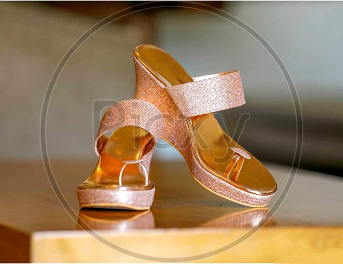 Pair of high heels Sandles golden colour